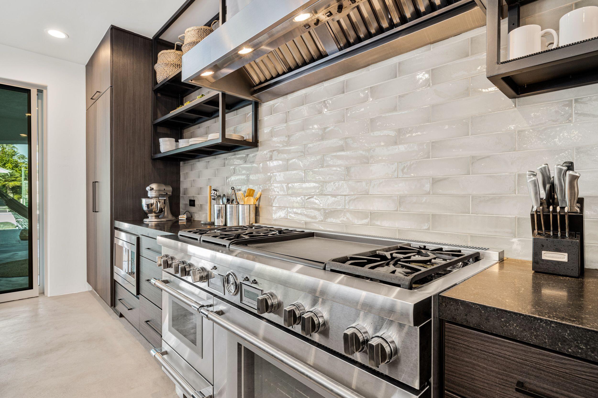 594 West Stevens Road Palm Springs, CA 92262 - Photo 8 of 28 a stove top oven sitting inside of a kitchen