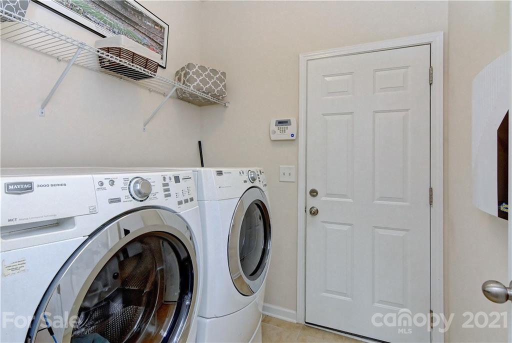 78203 Rillstone Drive Lancaster, SC 29720 - Photo 22 of 46 a view of storage and utility room with washer and dryer