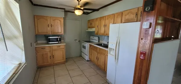 a kitchen with a refrigerator a sink and dishwasher