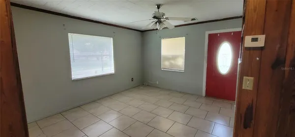 a view of an empty room with a window