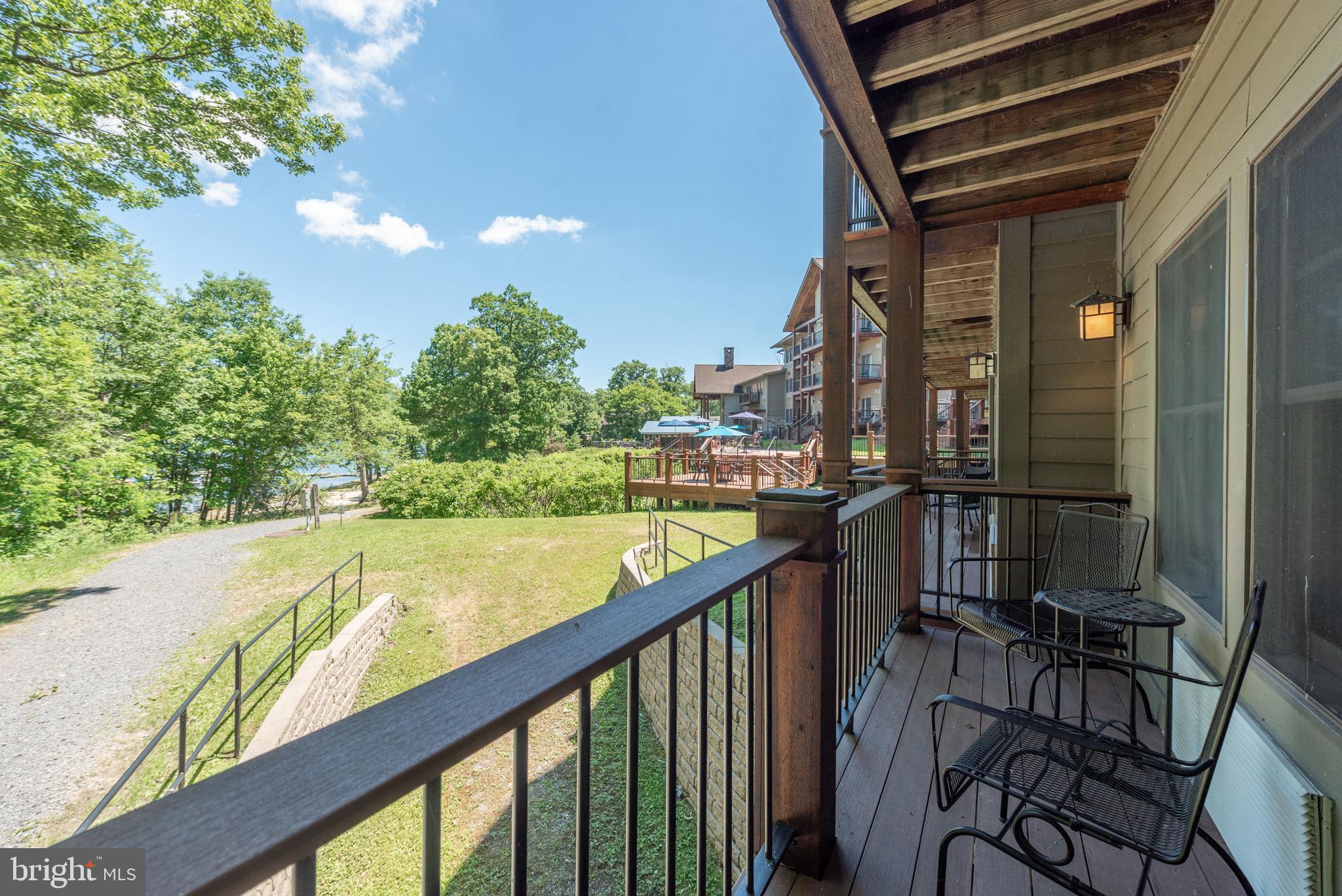 565 Glendale Road, Unit 106B Oakland, MD 21550 - Photo 2 of 27 a view of swimming pool from a balcony