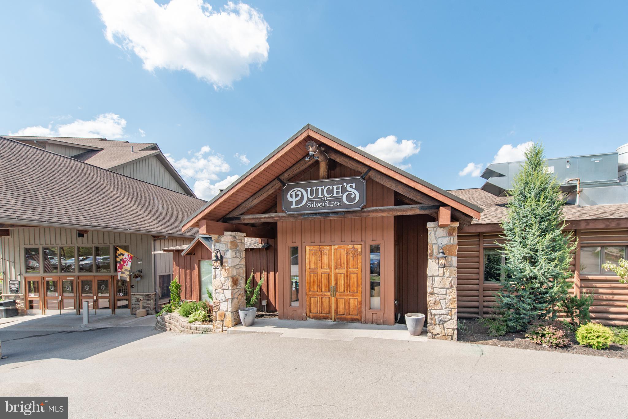 565 Glendale Road, Unit 106B Oakland, MD 21550 - Photo 25 of 27 a view of a building with car parked