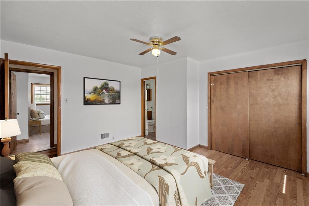 737 Railroad Street McKees Rocks, PA 15136 - Photo 11 of 17 a bedroom with a large bed and a chandelier