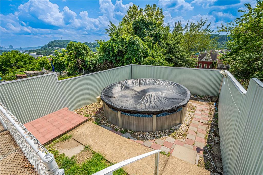737 Railroad Street McKees Rocks, PA 15136 - Photo 14 of 17 a view of a balcony with a table and chair