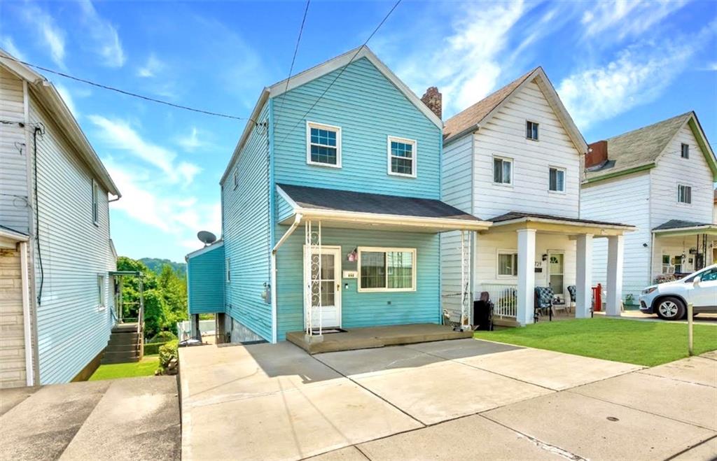 737 Railroad Street McKees Rocks, PA 15136 - Photo 2 of 17 a view of a white house with a chairs in front of a house