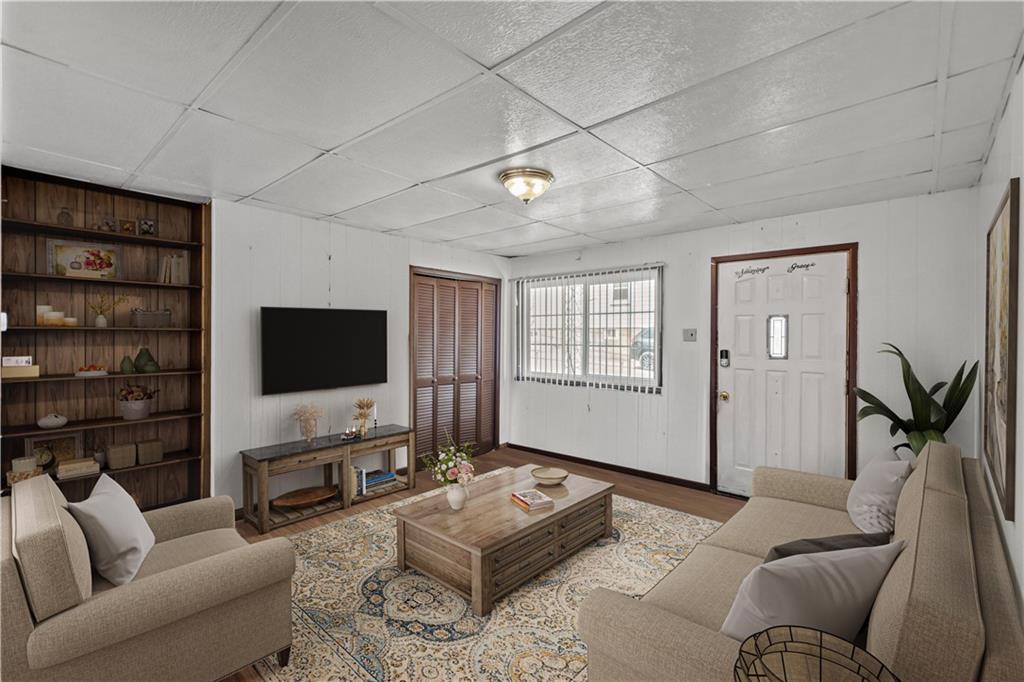 737 Railroad Street McKees Rocks, PA 15136 - Photo 5 of 17 a living room with furniture and a flat screen tv