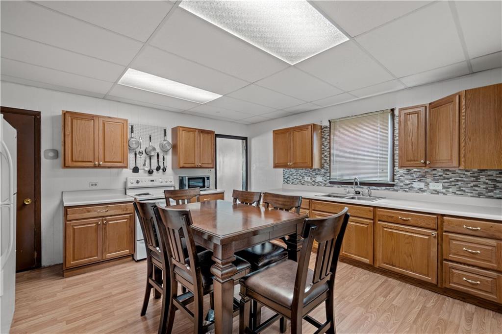 737 Railroad Street McKees Rocks, PA 15136 - Photo 6 of 17 a view of a dining room with furniture and wooden floor