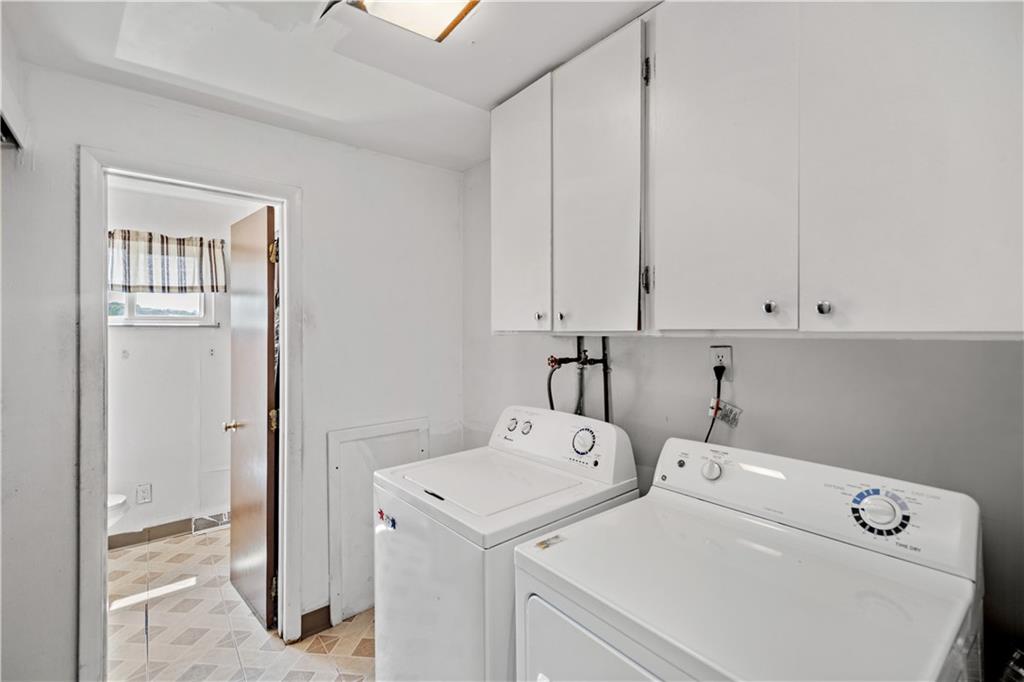 737 Railroad Street McKees Rocks, PA 15136 - Photo 8 of 17 a utility room with dryer and washer
