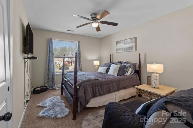 a bedroom with two beds and a table