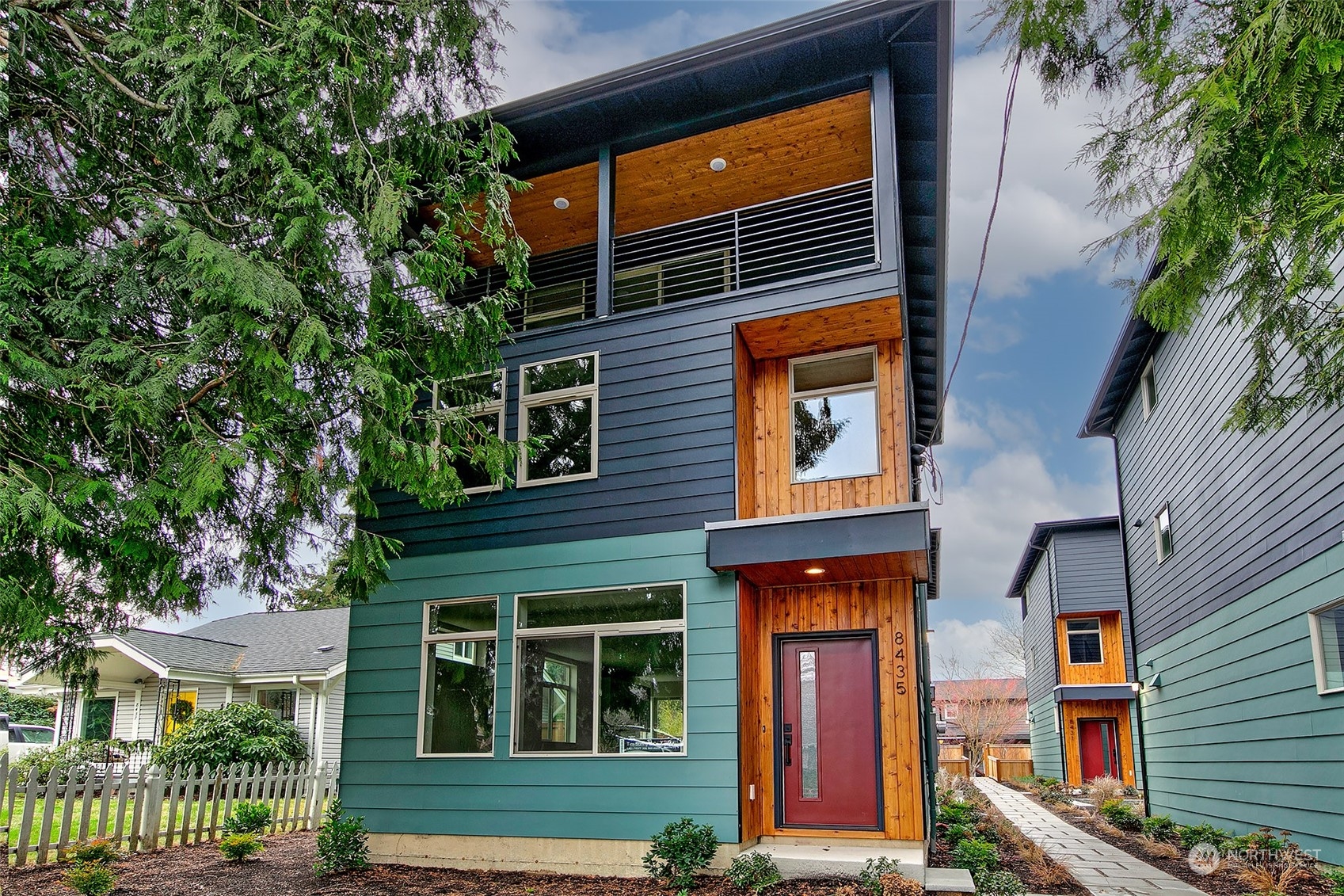 a front view of a multi story residential apartment building with a yard