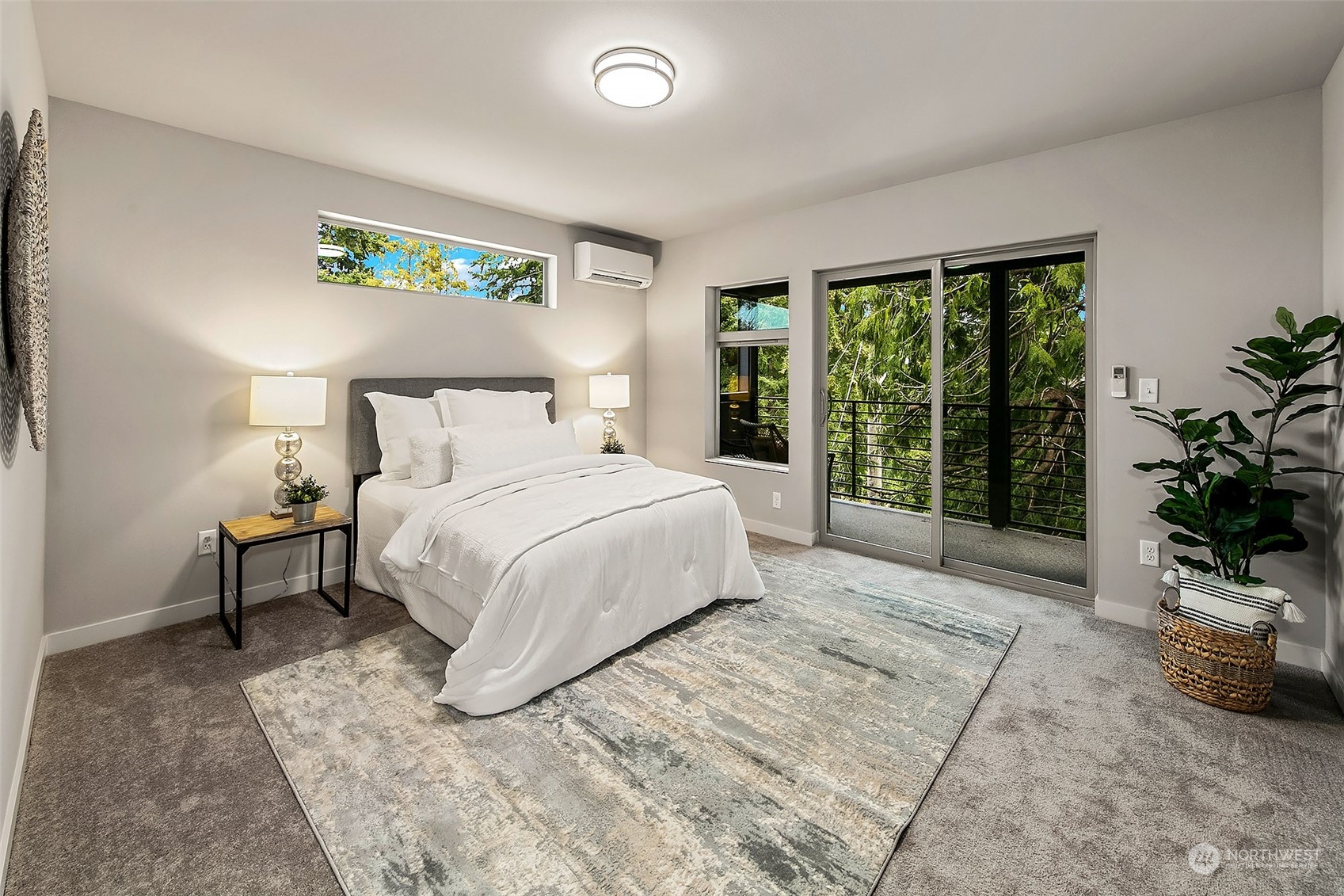 8435 22nd Avenue Southwest Seattle, WA 98106 - Photo 12 of 22 a bedroom with a large bed and a potted plant
