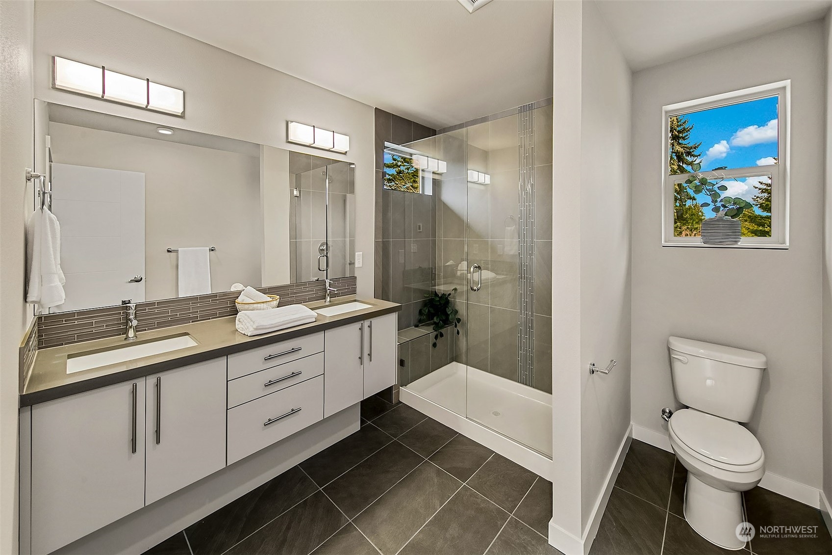 8435 22nd Avenue Southwest Seattle, WA 98106 - Photo 15 of 22 a bathroom with a double vanity sink toilet and shower