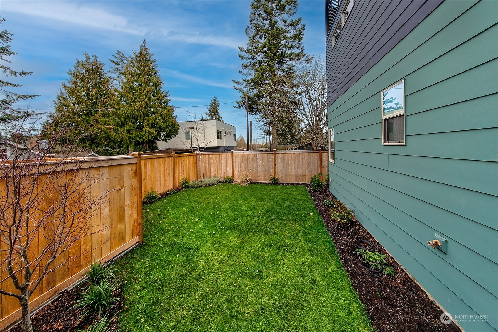 8435 22nd Avenue Southwest Seattle, WA 98106 - Photo 16 of 22 a view of backyard with wooden fence