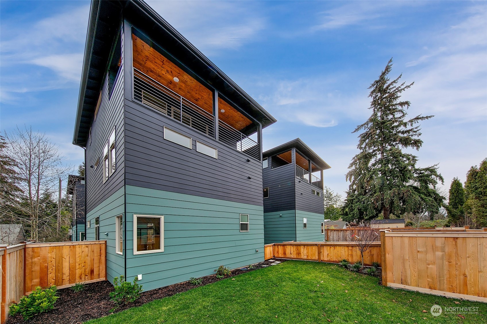 8435 22nd Avenue Southwest Seattle, WA 98106 - Photo 20 of 22 a backyard of a house with plants and tree