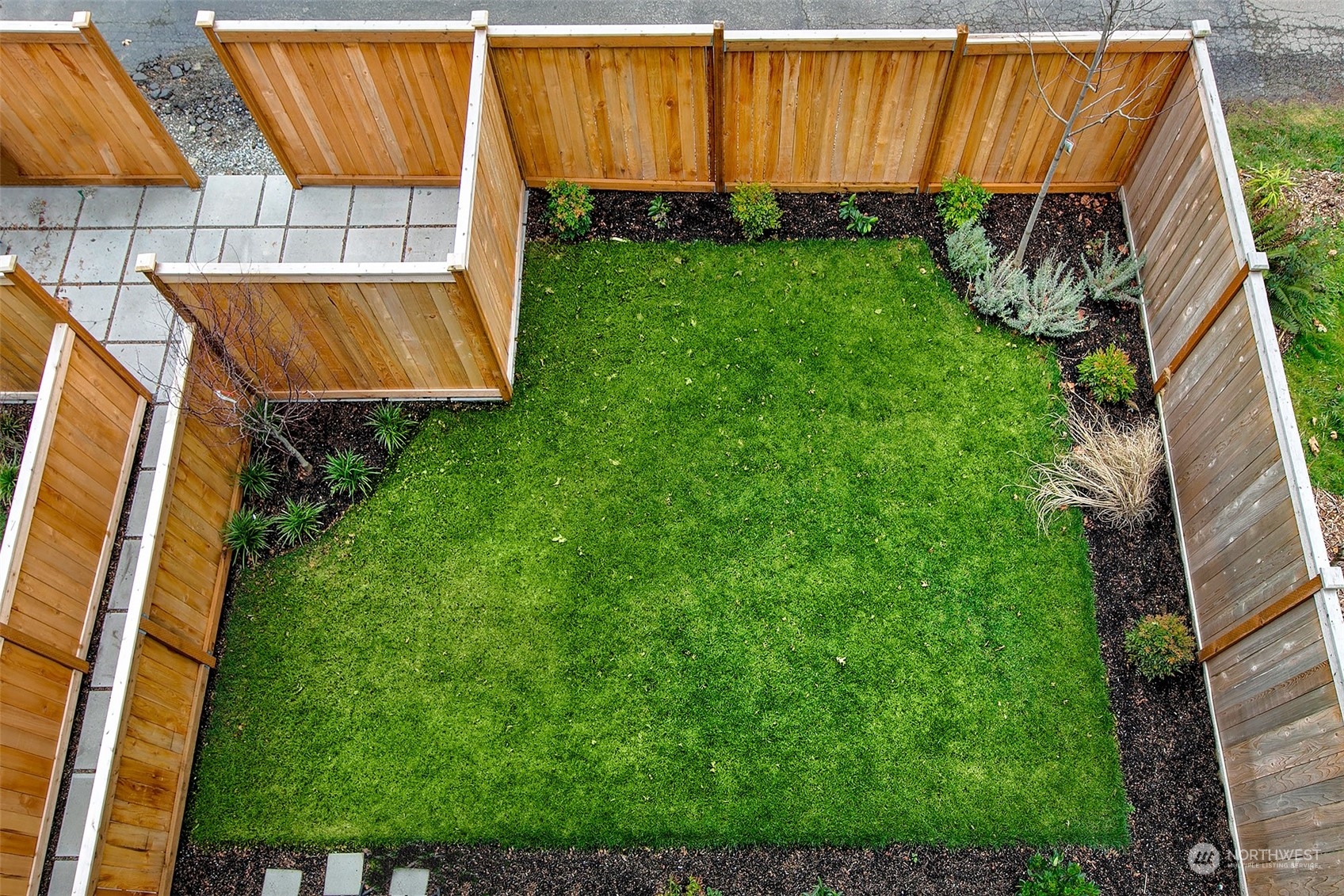 8435 22nd Avenue Southwest Seattle, WA 98106 - Photo 21 of 22 a view of a backyard with potted plants