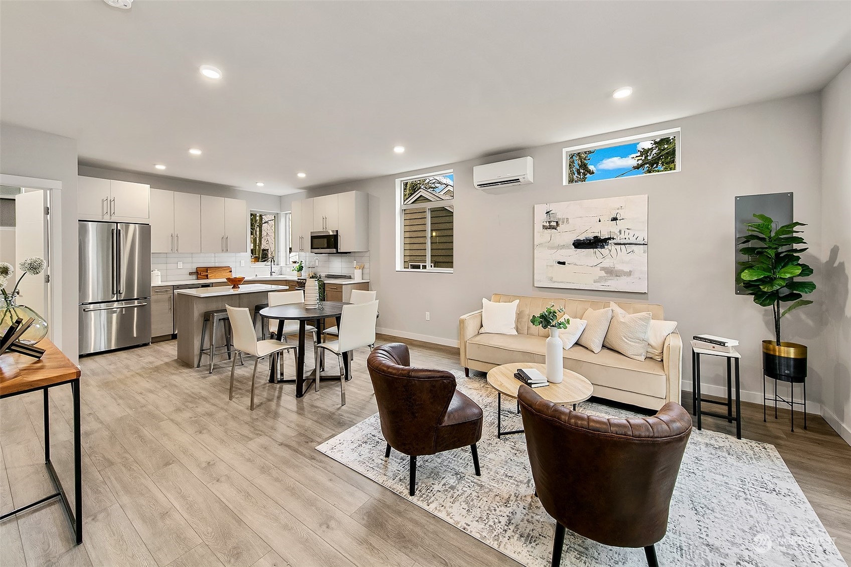 8435 22nd Avenue Southwest Seattle, WA 98106 - Photo 4 of 22 a living room with furniture kitchen view and a refrigerator