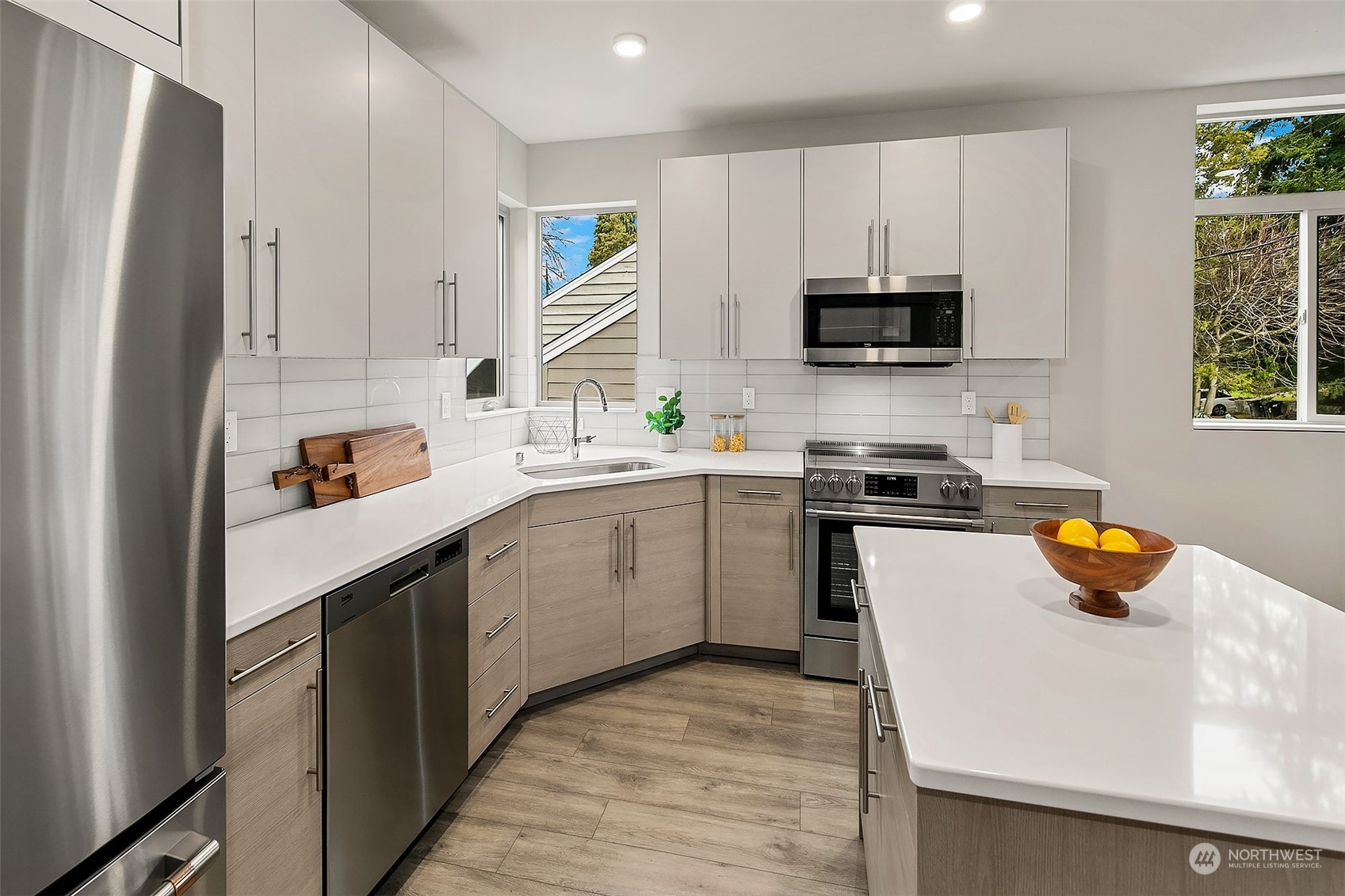 8435 22nd Avenue Southwest Seattle, WA 98106 - Photo 6 of 22 a kitchen with a sink a stove and cabinets