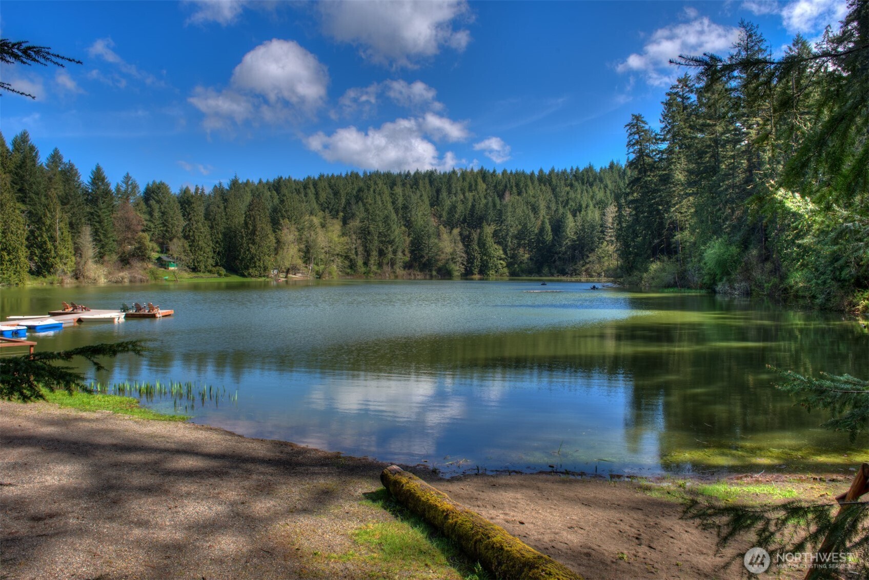 1546 Reservation Road Southeast, Unit 200 Olympia, WA 98513 - Photo 17 of 21 a view of a lake with a yard
