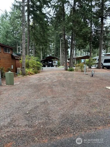 a view of outdoor space with deck and tree