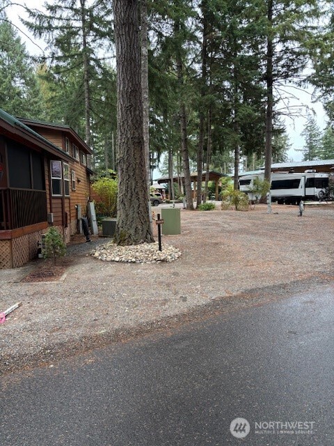 1546 Reservation Road Southeast, Unit 200 Olympia, WA 98513 - Photo 3 of 21 a view of outdoor space with deck and tree