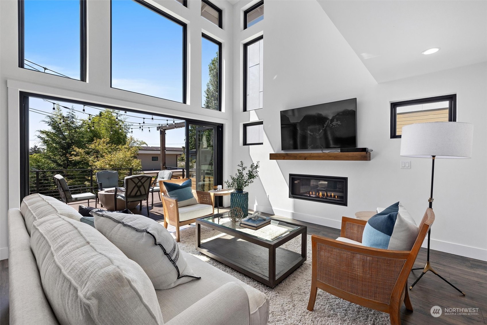 331 8th Avenue Kirkland, WA 98033 - Photo 12 of 40 a living room with furniture a flat screen tv and a fireplace