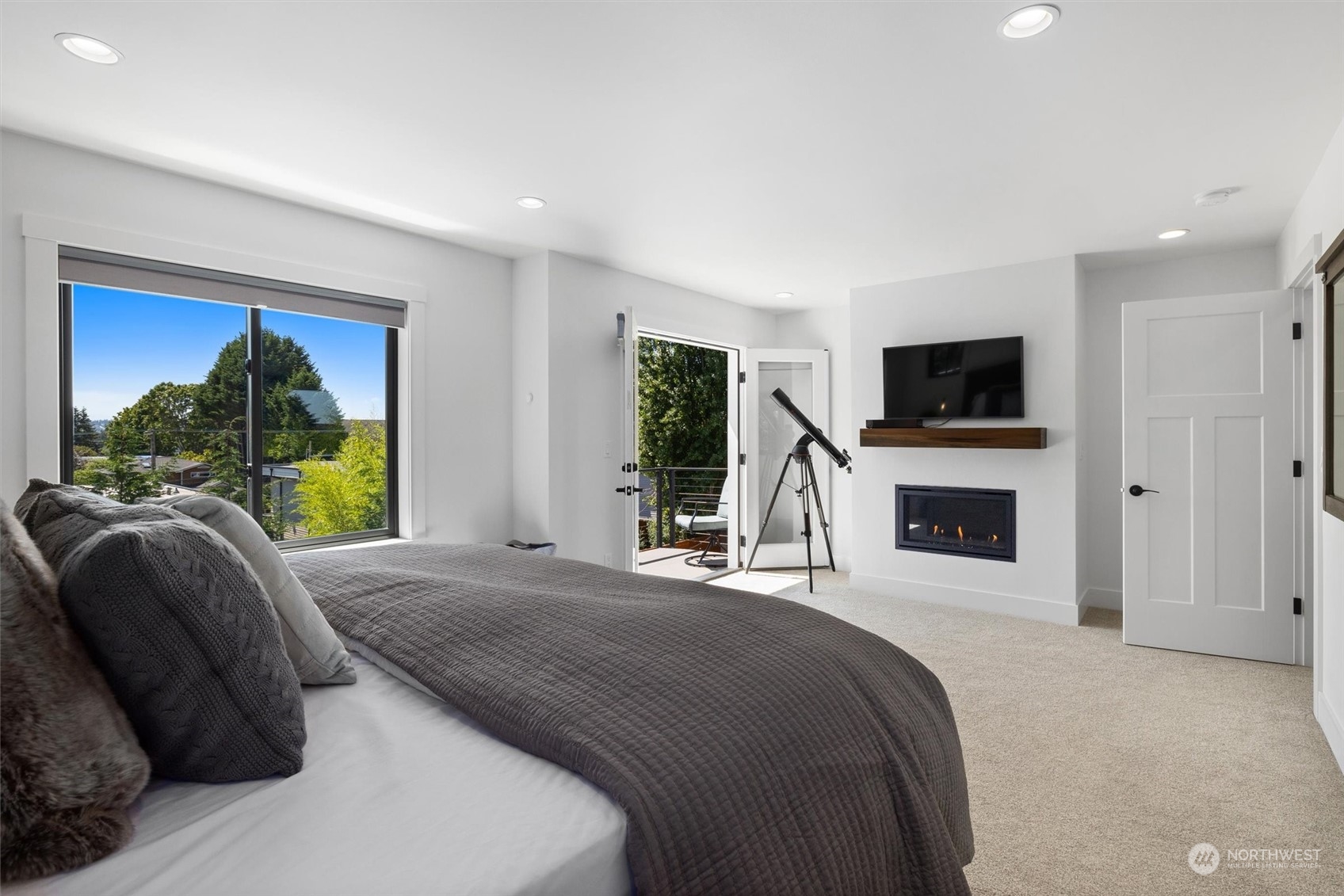 331 8th Avenue Kirkland, WA 98033 - Photo 21 of 40 a bedroom with a bed and a flat screen tv