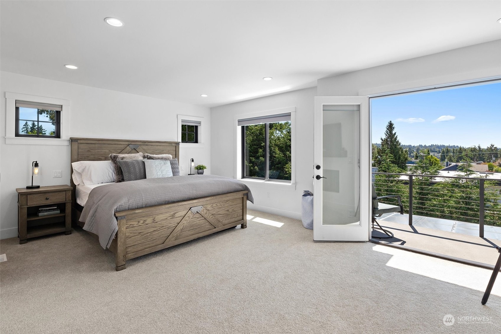 331 8th Avenue Kirkland, WA 98033 - Photo 22 of 40 a bedroom with a large bed and a balcony view