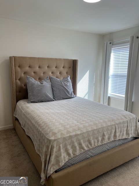832 Ambient Way Atlanta, GA 30331 - Photo 22 of 32 a large bed sitting in a bedroom next to a window