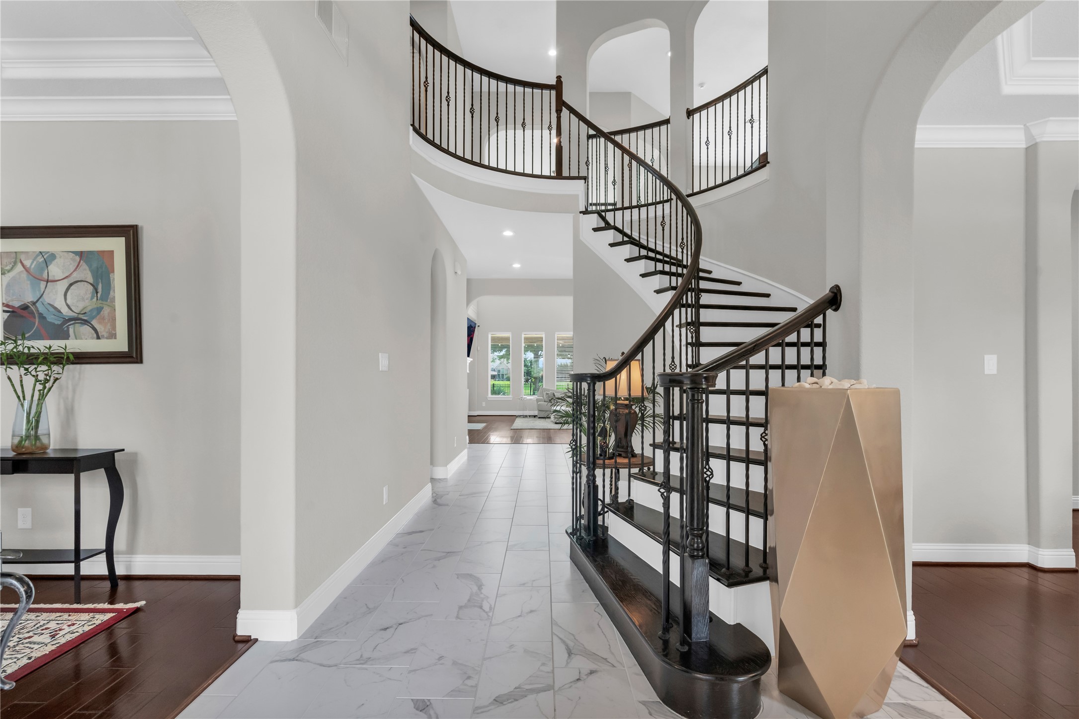 9842 Kirkstone Terrace Drive Spring, TX 77379 - Photo 5 of 34 Stunning entrace showcases a modern, elegant foyer with a sweeping staircase and high ceilings. The space features a mix of tile and hardwood flooring, neutral walls, creating a welcoming and sophisticated entrance to the home. To the right is the formal dining or...? To the left is the office
To the
