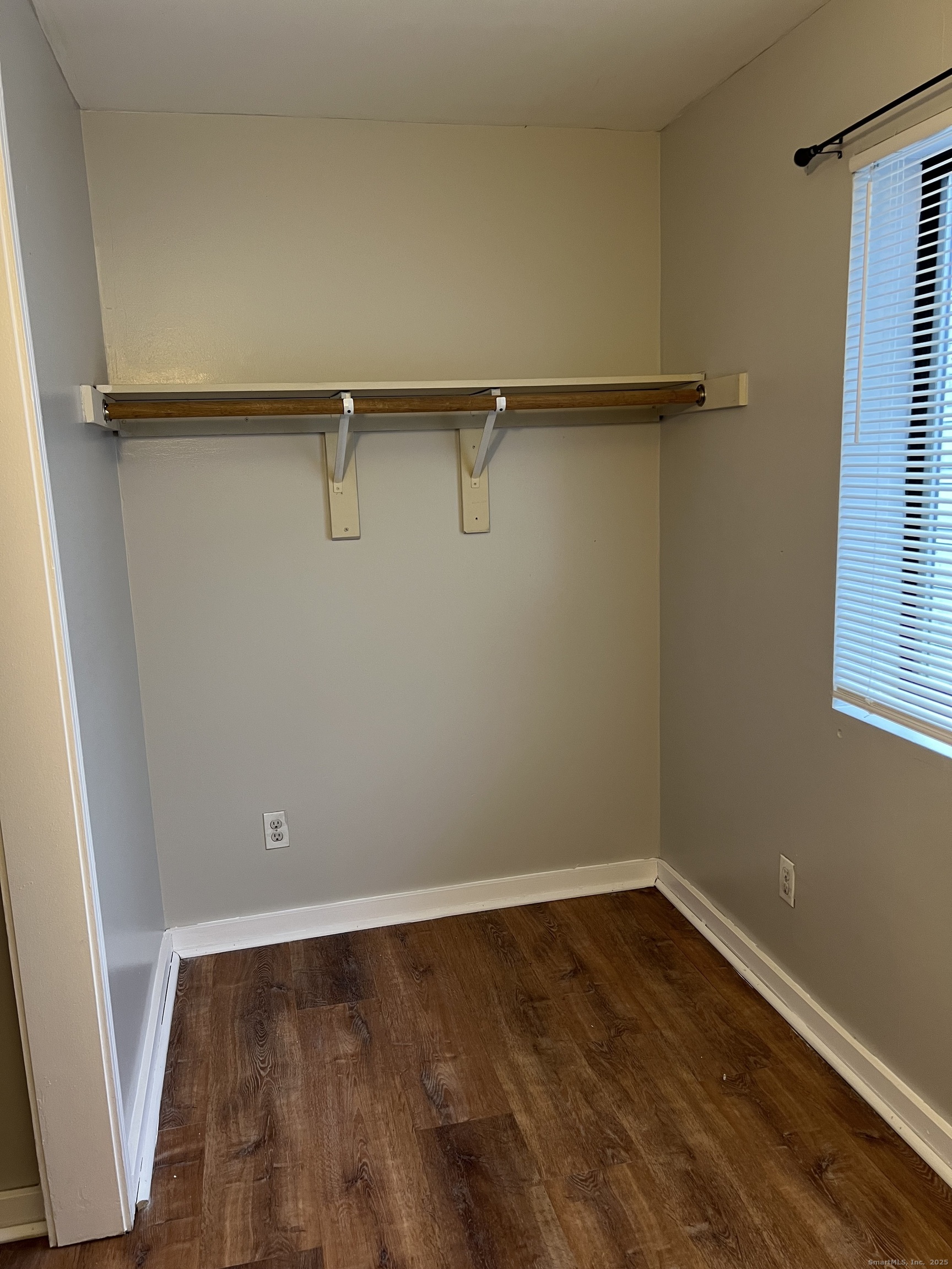385 Putnam Avenue, Unit 35 Hamden, CT 06517 - Photo 17 of 17 a view of a room with wooden floor and small window