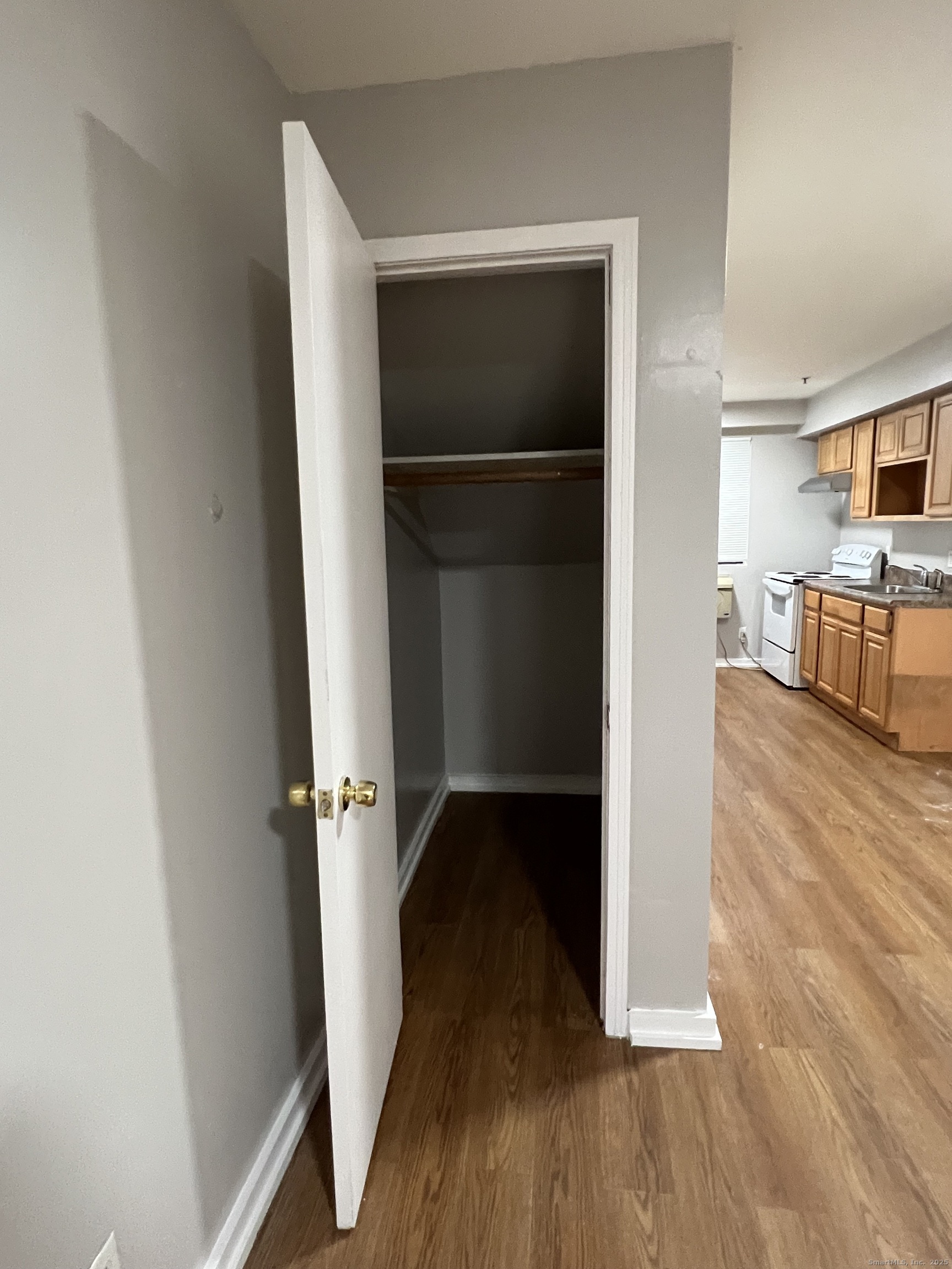 385 Putnam Avenue, Unit 35 Hamden, CT 06517 - Photo 5 of 17 wooden floor in an empty room