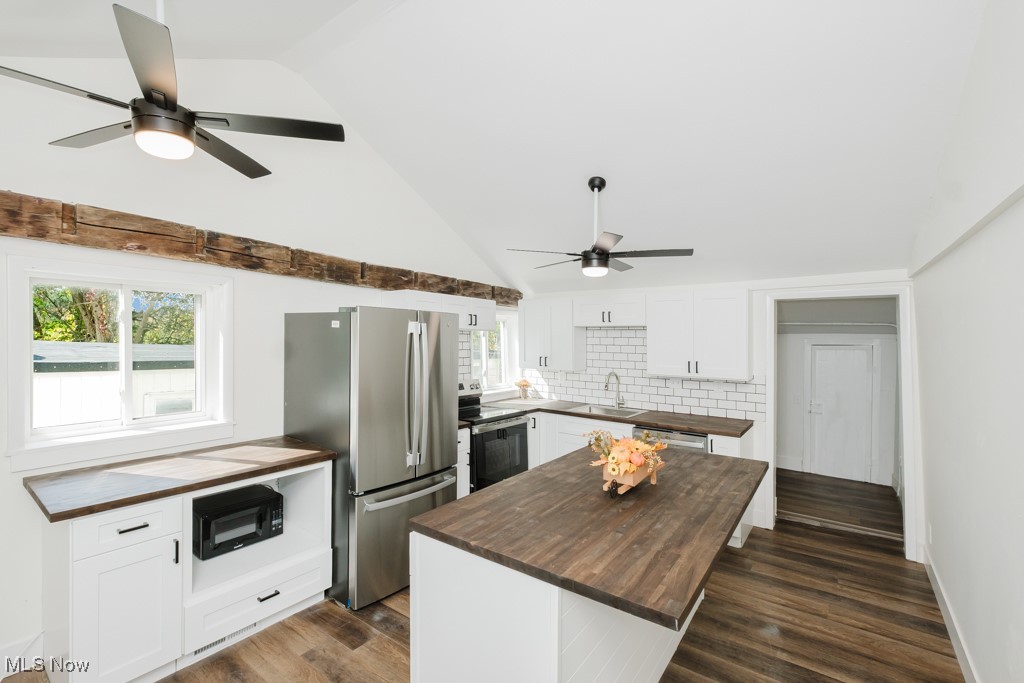 8150 Madison Road Thompson, OH 44086 - Photo 7 of 28 Kitchen featuring white cabinetry, a ceiling fan, butcher block counters, dark wood-style floors, and stainless steel appliances