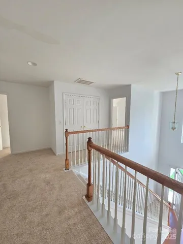 a view of hallway with stairs