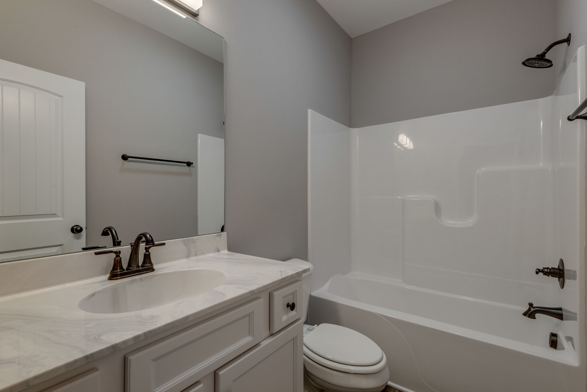 1156 Oak Grove Road Dickson, TN 37055 - Photo 10 of 13 a bathroom with a sink a toilet and a bathtub
