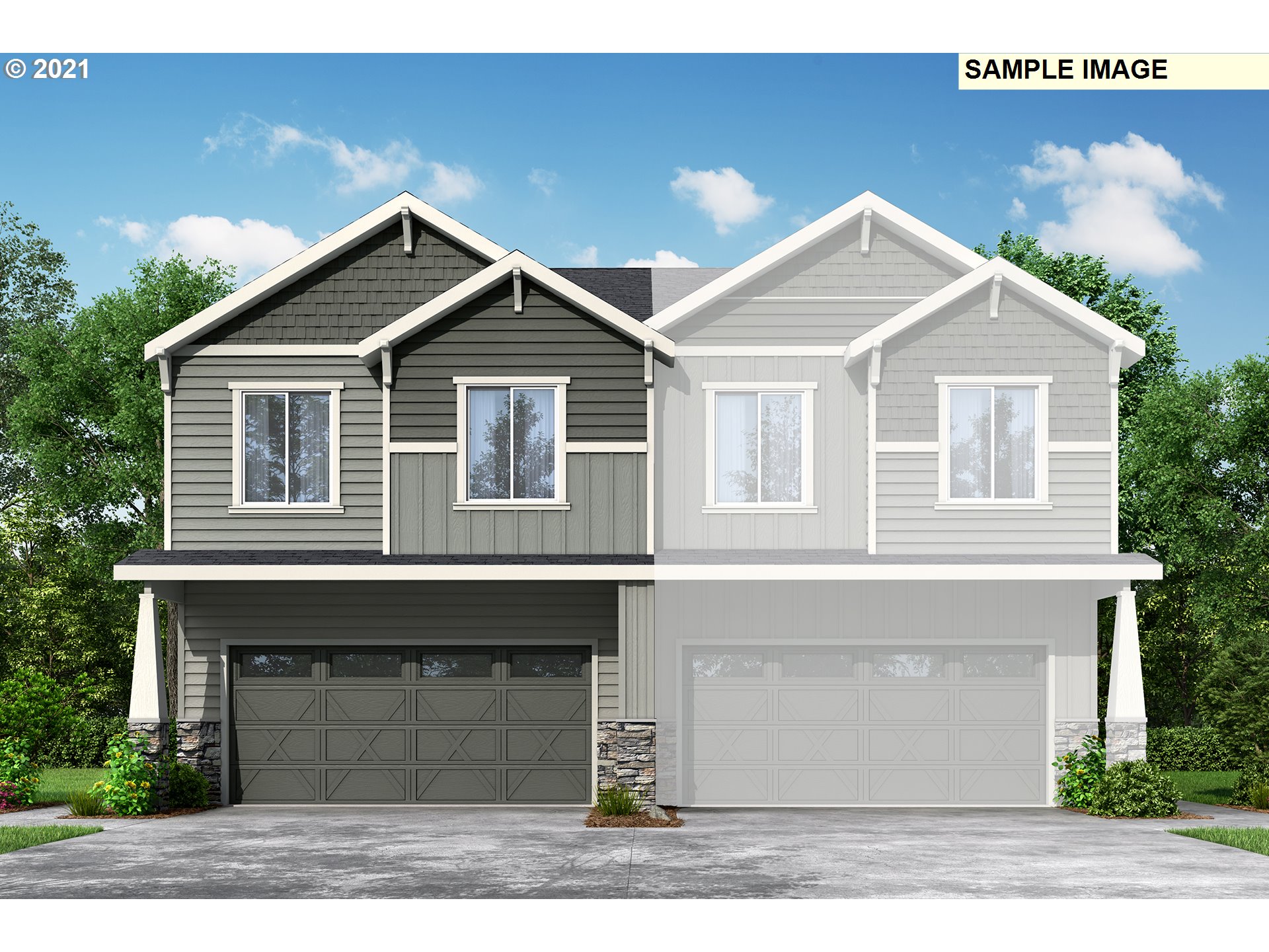 a front view of a house with garage