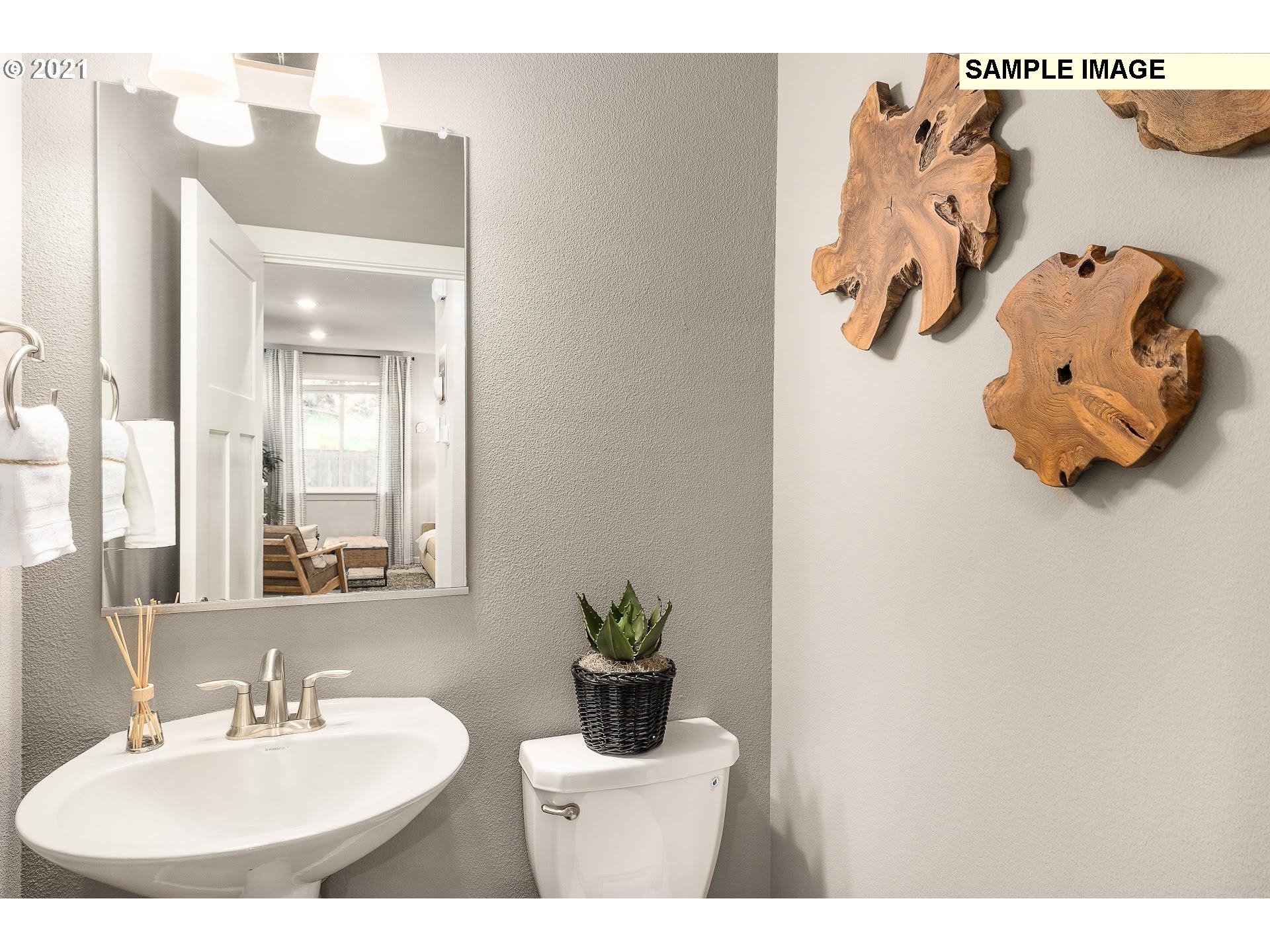 4260 South Laughing Water Circle Ridgefield, WA 98642 - Photo 18 of 24 a bathroom with a sink and mirror