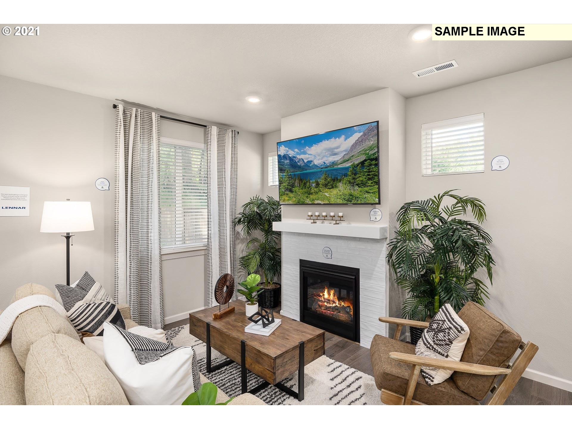 4260 South Laughing Water Circle Ridgefield, WA 98642 - Photo 6 of 24 a living room with furniture and a fireplace