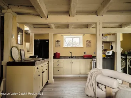a bedroom with double bed and a window