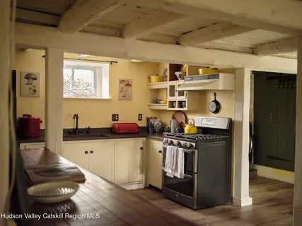 a bedroom with a bed and a mirror