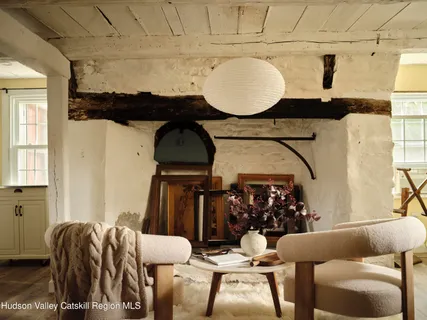 a bedroom with a bed and a mirror