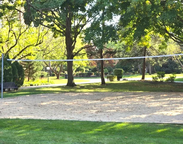 a view of outdoor space with garden and trees