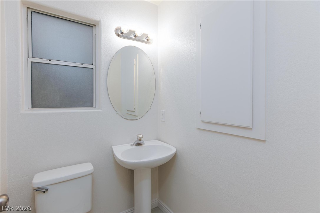 2246 Ramsgate Drive Henderson, NV 89074 - Photo 25 of 36 A well-lit powder room offers privacy and essential conveniences.