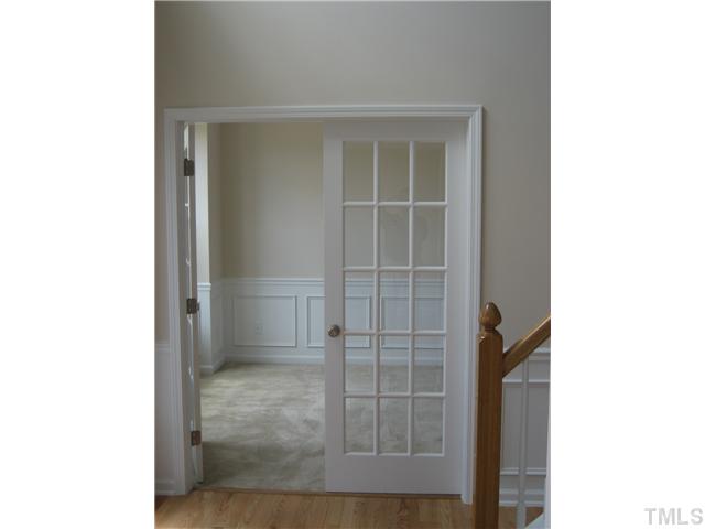 242 Forbes Road, Unit LOT16 Wake Forest, NC 27587 - Photo 3 of 12 Private study features bay window and double 15-lite doors, chair rail and shadow box, 2-piece crown molding appointments too!