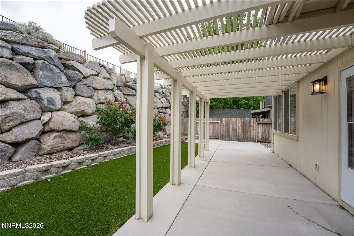 2329 Red Maple Court Reno, NV 89523 - Photo 32 of 39 a view of a patio with wooden floor and iron fence