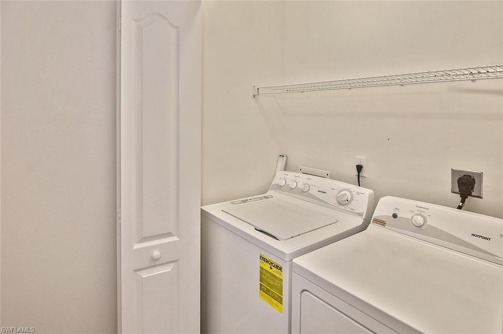 3830 Sawgrass Way, Unit 2914 Naples, FL 34112 - Photo 15 of 50 a utility room with dryer and washer
