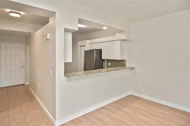 a view of kitchen with a sink and dishwasher