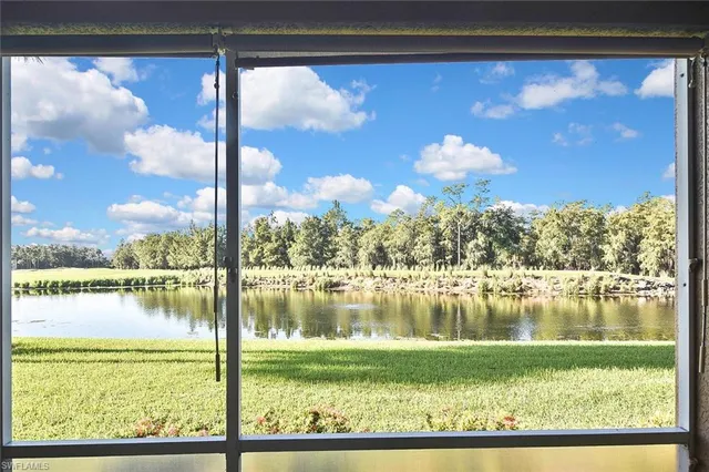 a view of a lake with a yard