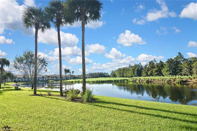 a view of a lake in between two of people
