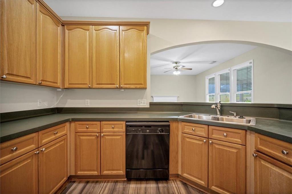 501 Middlebrooke Trace Canton, GA 30115 - Photo 12 of 29 a kitchen with stainless steel appliances granite countertop a sink and cabinets