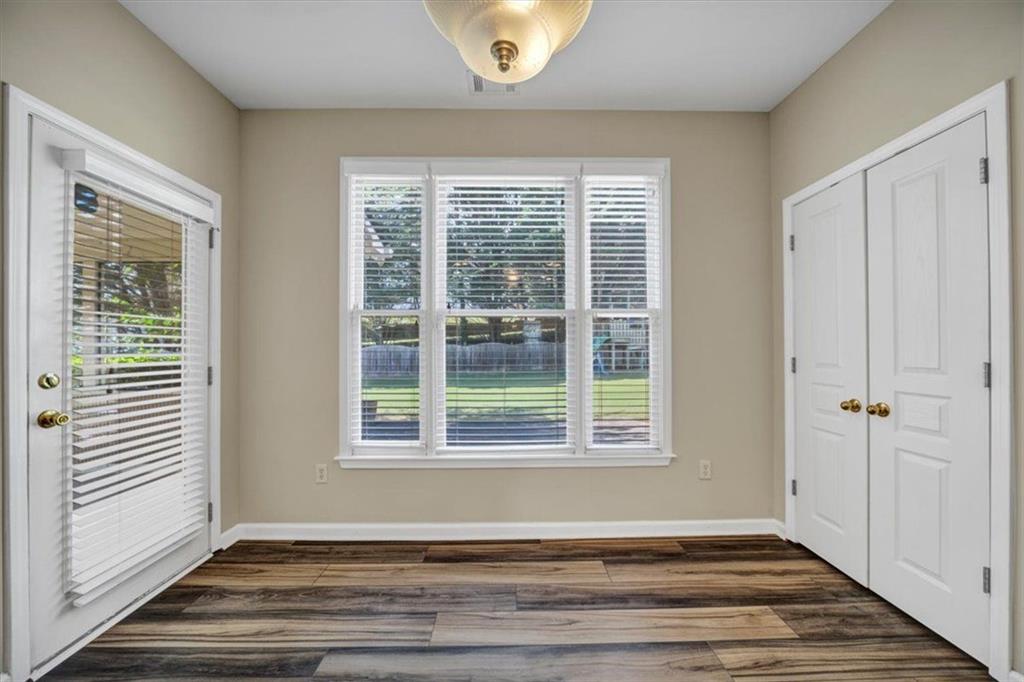 501 Middlebrooke Trace Canton, GA 30115 - Photo 18 of 29 a view of an empty room with wooden floor and a window